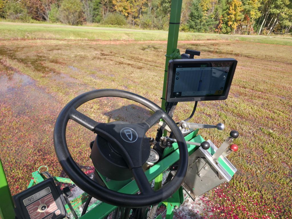 FJD AT2 auto steer installed on a cranberry harvester